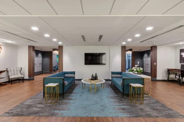 Cozy lounge area with teal sofas and modern decor