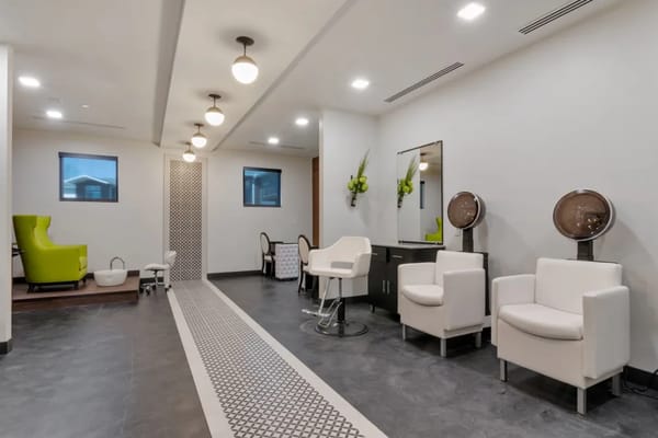 Modern salon area with seating and styling stations