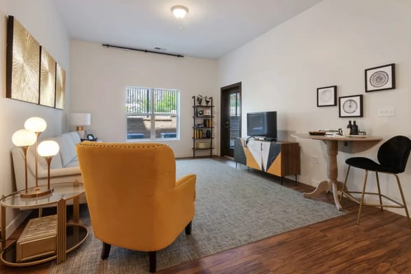 Bright and inviting living room with a yellow armchair and modern decor