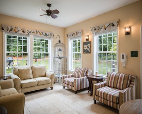 Inviting living room with comfortable seating and large windows