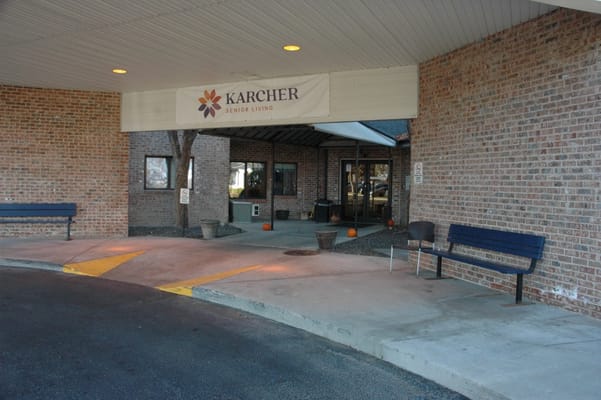 Entrance of Karcher Senior Living with benches