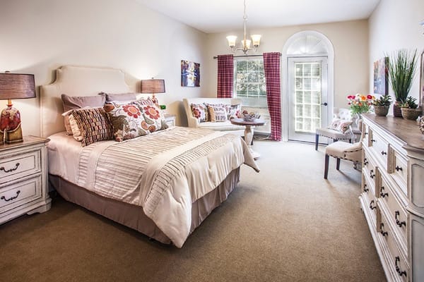 Well-furnished resident room with natural light