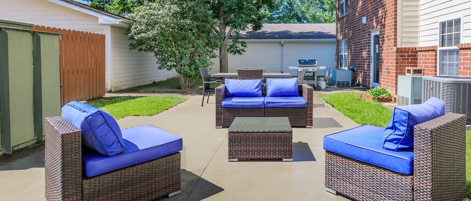 Outdoor seating area with blue cushions