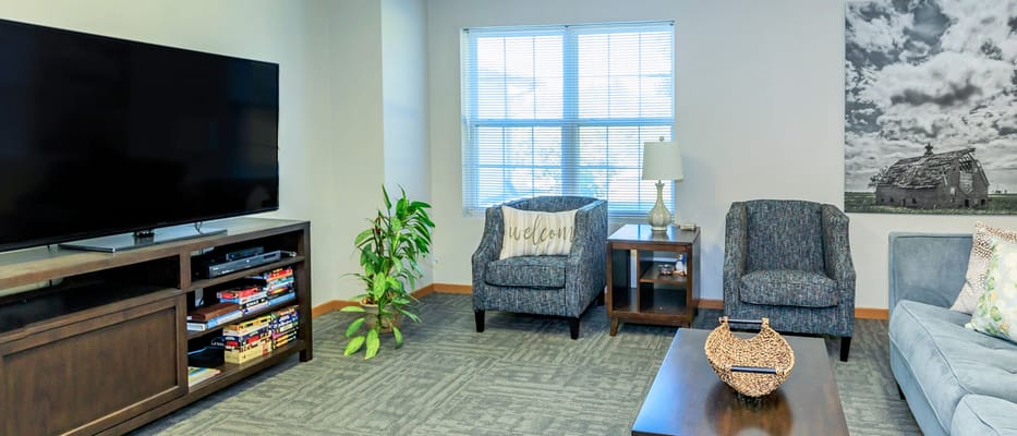 Cozy common area with seating and a television