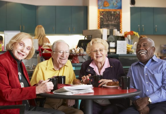 Residents enjoying coffee together in a common area