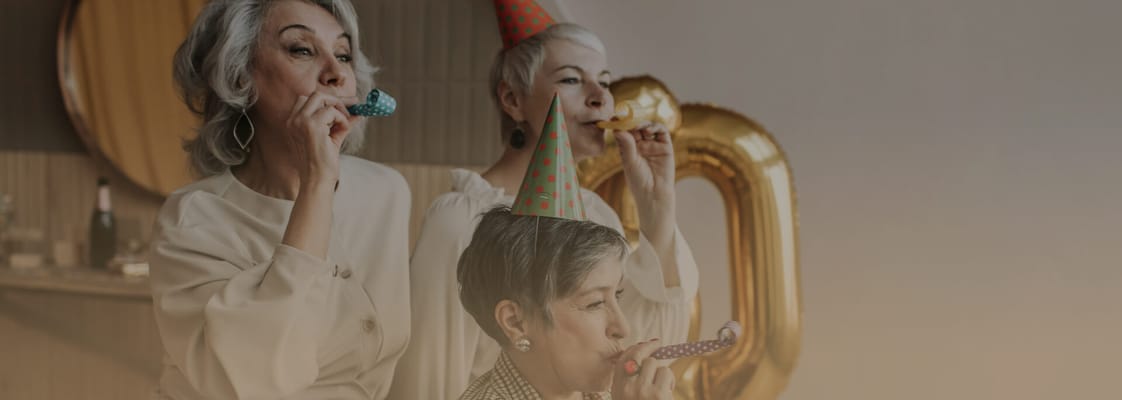 Celebrating residents with party hats and noisemakers