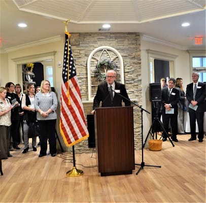 A speaker addressing residents and staff during an event