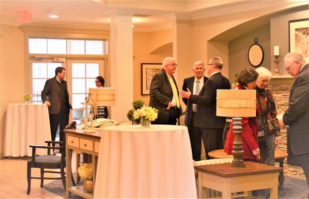 Guests mingling in a common area during an event