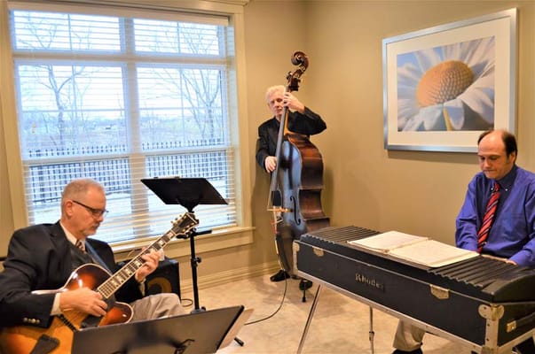 Musicians playing in a bright interior space