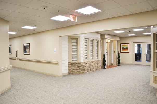 Bright interior hallway of a senior care facility