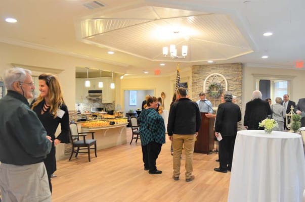 Residents and staff mingling in a community event space