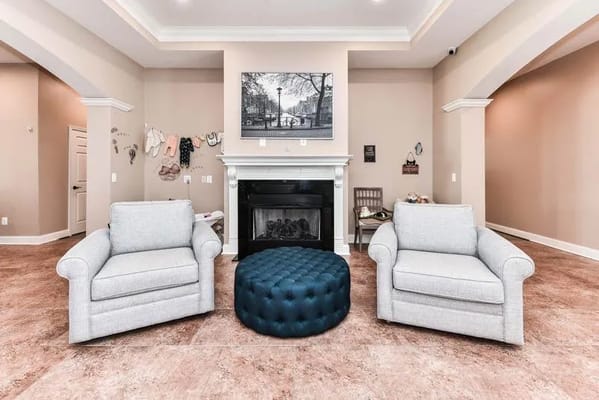 Bright common area with comfortable seating and fireplace