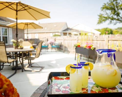 Outdoor patio area with lemonade and people