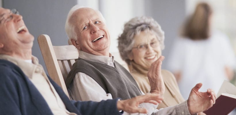 Three residents enjoying time together in rockers