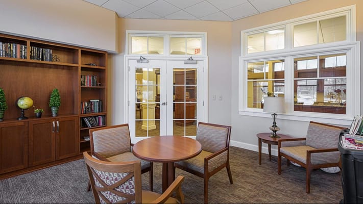 Bright common area with seating and bookshelves
