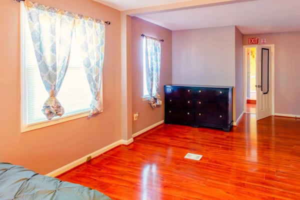 Interior view of a resident room with wood flooring