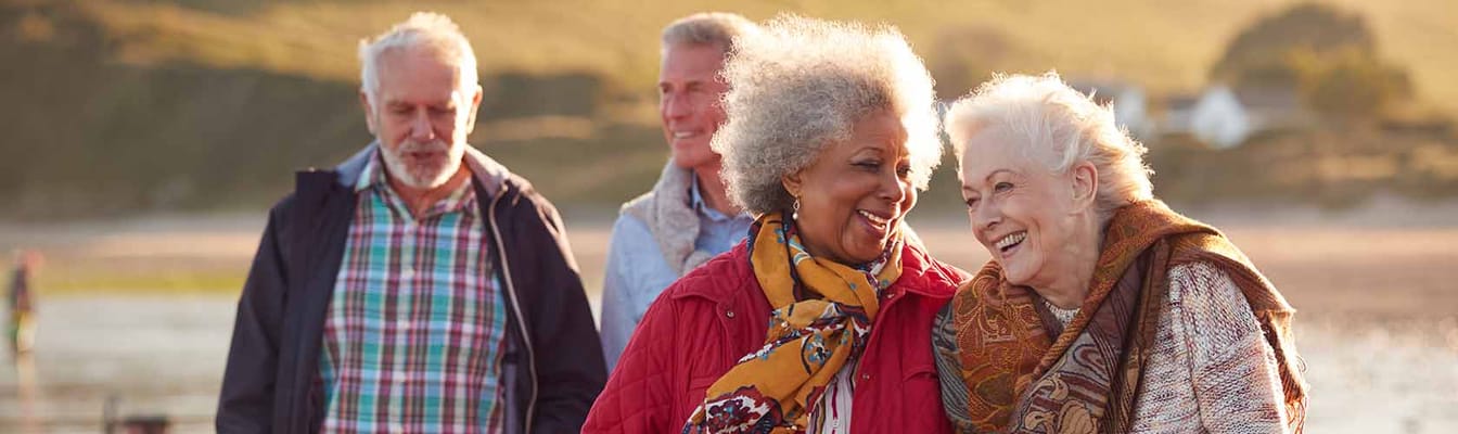 Seniors enjoying a walk outdoors together