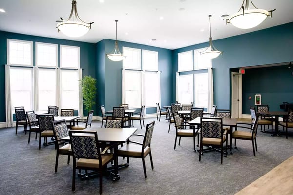 Interior view of a common area with tables and chairs