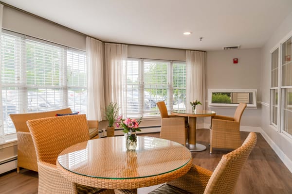 Bright common area with tables and chairs