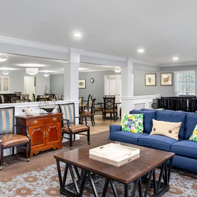 Bright common area with seating and piano