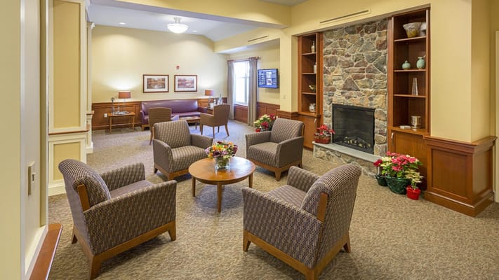 Common area with cozy seating and a fireplace