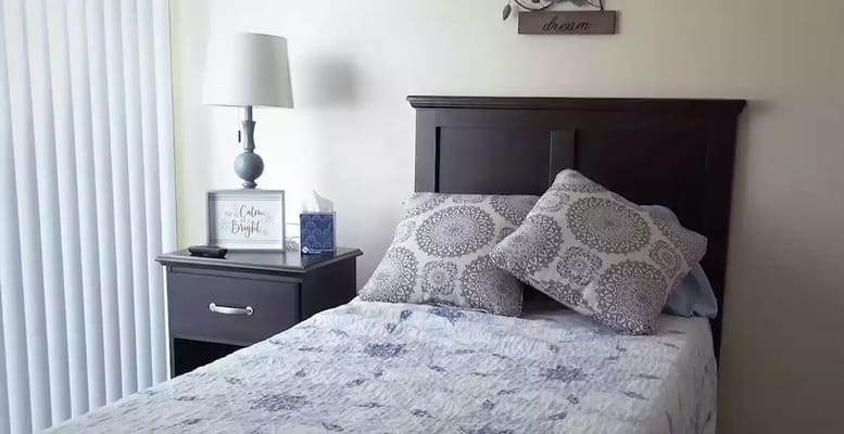 Cozy private resident room with decorative bedding