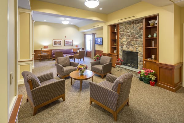 Common area with seating and a fireplace