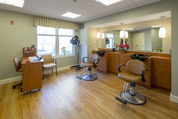 Interior view of a hair salon with styling chairs