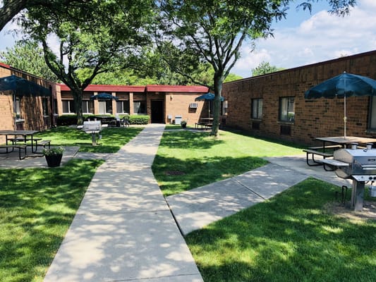 Outdoor courtyard with seating and paths