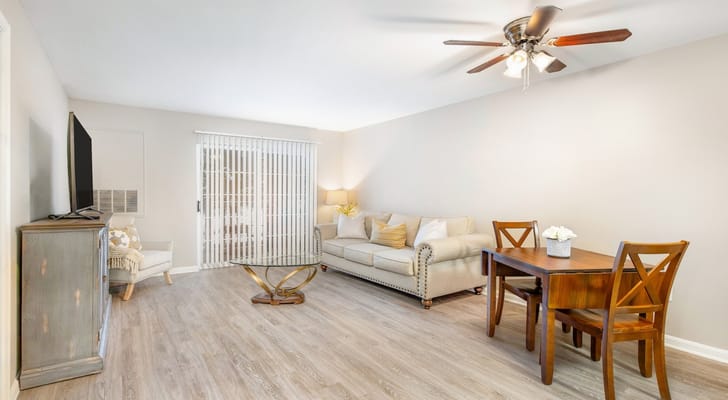 Bright interior of a living space with a sofa and dining table