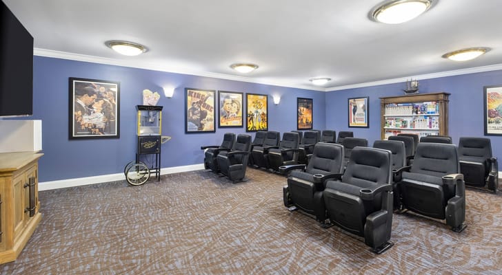 Interior common area with theater seating and posters