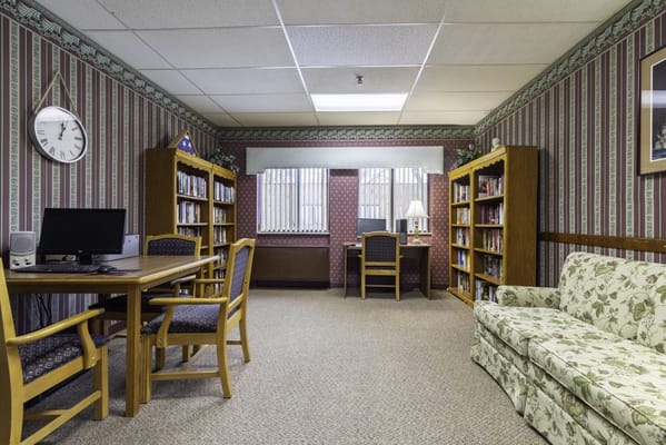 Common area with seating and bookshelves