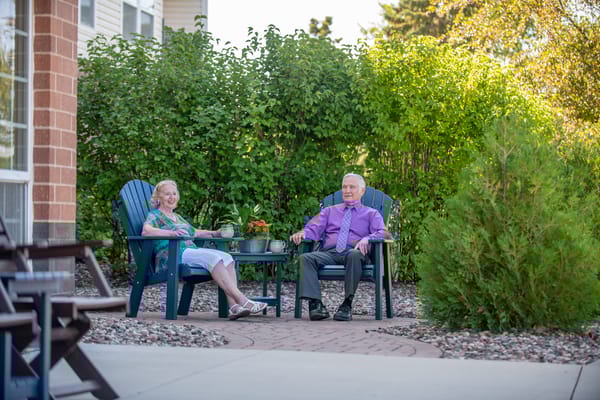 Residents enjoying the outdoor seating area