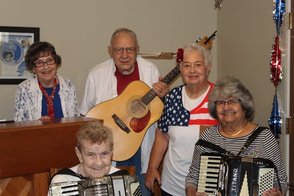 Residents enjoying a music activity with instruments
