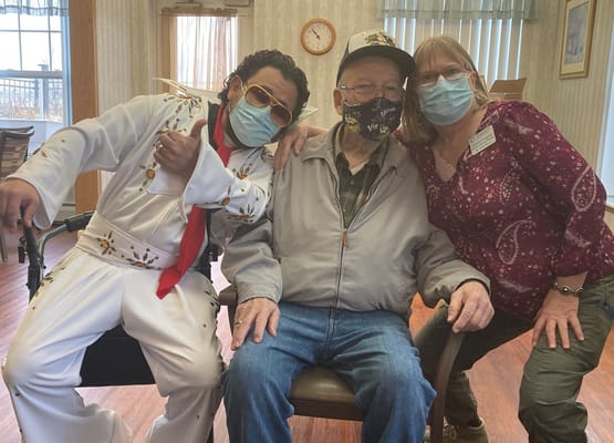 Residents enjoying a lively event with an entertainer