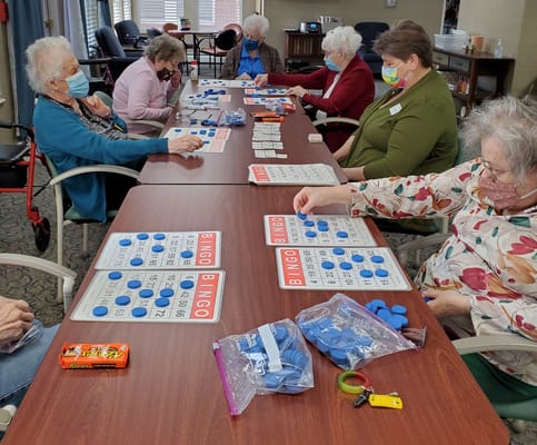 Residents playing bingo in a common area