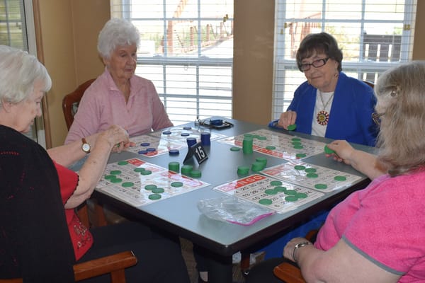 Residents enjoying a game of bingo in an activity room