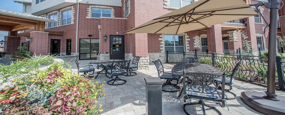Outdoor seating area with tables and umbrellas