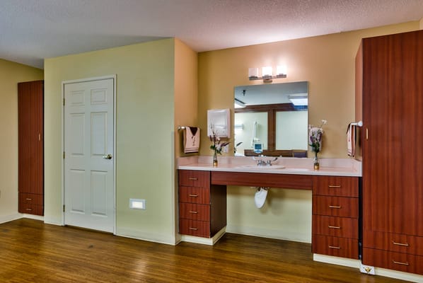 Bathroom area with a sink and mirror