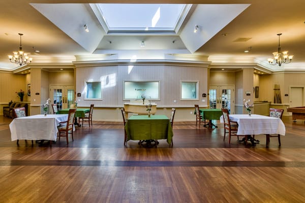 Interior view of a dining room with tables set