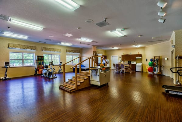 Interior view of a rehabilitation activity room with equipment