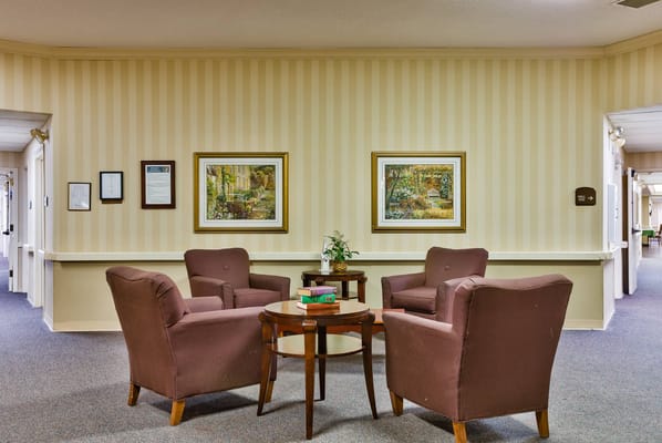 Bright common area with seating and artwork