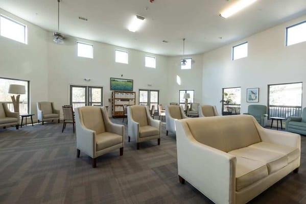 Bright common area with seating and windows