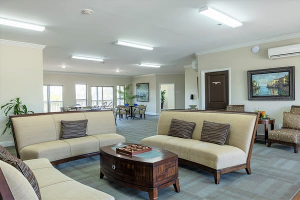 Bright common area with seating and artwork