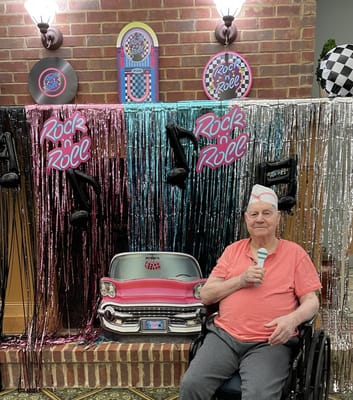 Resident enjoying a themed activity in the facility