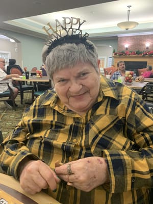 A resident celebrating New Year in a common area