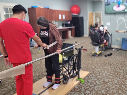 Residents participating in physical therapy exercises