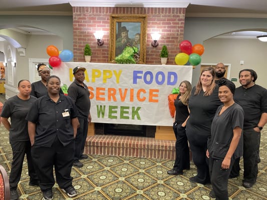 Staff celebrating Food Service Week in the common area