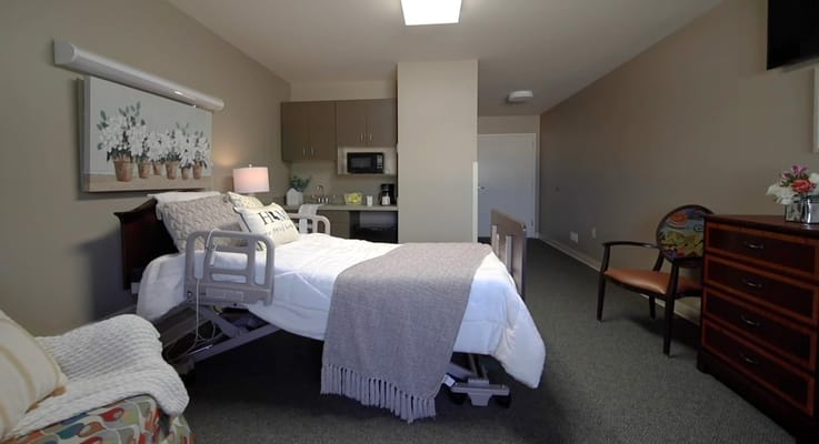 Private resident room with bed and amenities