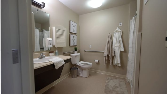 Clean and organized resident bathroom with amenities